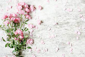 Pink rose flowers bouquet mockup on white rustic wooden background