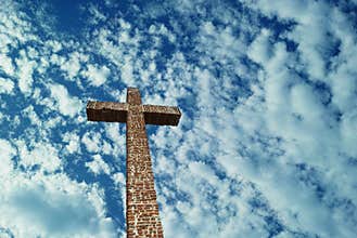 Christian Cross over bright sky