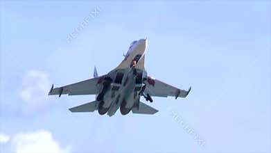 A military fighter jet SU-27 taking off from the airfield during military exercises