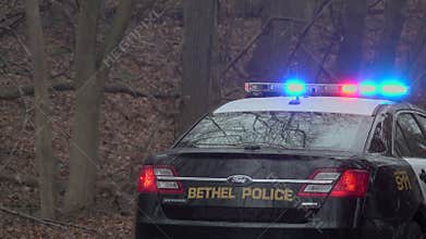 Back of a police car near a emergency