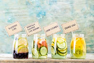 Variety of fruit infused detox water in jars
