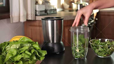 Making a green juice in the kitchen