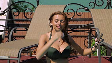 Bikini Girl selfie at the edge of swimming pool