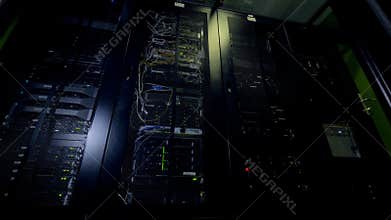 Nighttime operations of glowing data center hardware.