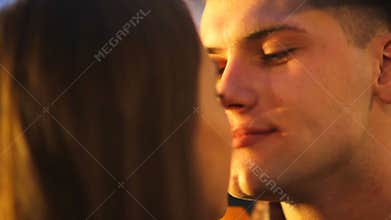 Portrait of a beautiful couple in the light of a spotlight in love