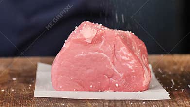 Raw meat, the hands of salt