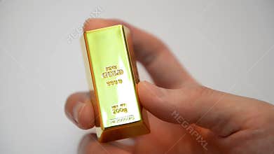 Reflections on stack of gold bars