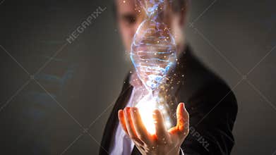 Close up of Businessman holding glowing DNA helix with energy sp