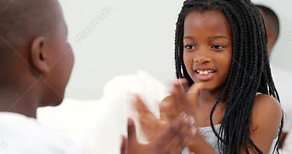 Children playing on bed