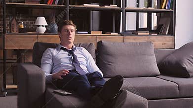 Football fan in apartment.