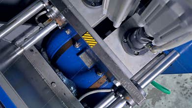 PET bottles production line. A close-up view of blow-molding machine inside chamber.