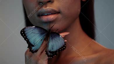 Young beautiful afro girl, with butterflies, beauty portrait