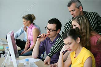 Trainer with young adults in a conference room