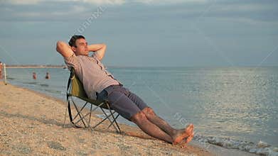 Man relaxing on deckchair