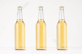 Set of three transparent longneck beer bottle 500ml with lager, mock up.