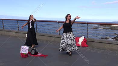 Two spanish woman dancing in Puerto De La Cruz street, Spain