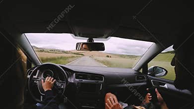 View from inside car on couple driving
