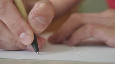 A man begins to write a letter