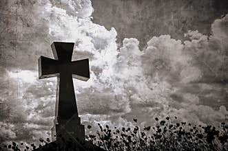 Grunge image of a cross in the cemetery, perfect halloween background