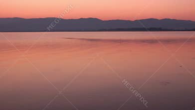 Peaceful purple atmosphere at Sunrise, sunset over Dojran Lake