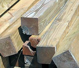 A Sunlit Stack of Damaged Lumber.