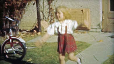 HOUSTON, TEXAS 1953: Little girl mimics ballroom dancing with kicking.