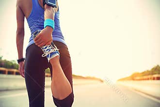 Asian woman stretching legs