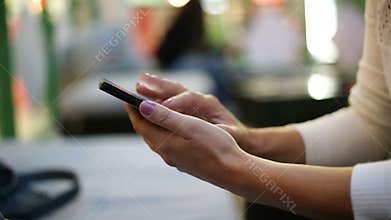 Female typing on a phone