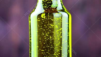Close-up of pouring olive oil in the bottle on wood background