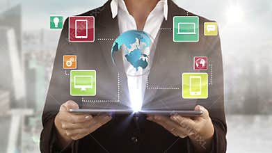 A woman presenting some electronic devices