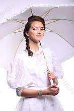 Portrait of young woman with umbrella retro wedding