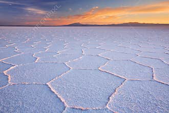 Salt flat Salar de Uyuni in Bolivia at sunrise