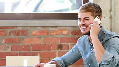 Happy hipster man texting and calling