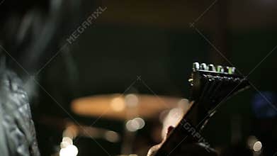 Vocalist and drummer of black metal band at dark background