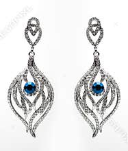 Earrings with blue stones on the white