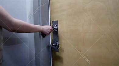 Woman opening apartment door