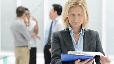 Mature Businesswoman checking the document