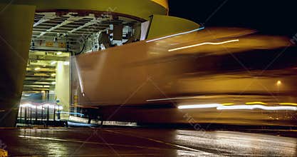 Cars and trucks exiting big ferry