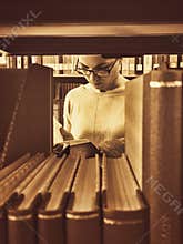 Grainy Vintage effect woman student reading book