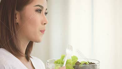 Woman eating salad