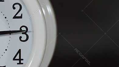 Table clock timelapse with television at the background