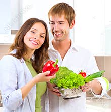 Young couple cooking healthy food