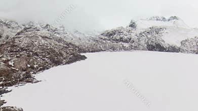 Drone flying across lake in Arctic