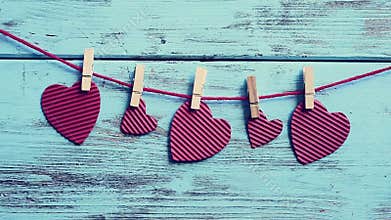 Cinemagraph of some hearts swaying in a clothes line