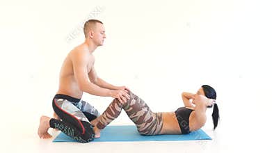 Young Woman Doing Sit-Ups with Turns