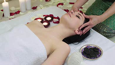 Beautiful Woman Receiving Face Massage in Spa