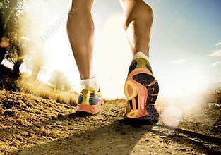 Strong legs and shoes of sport man jogging in fitness training workout on off road