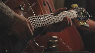 Jazz guitar trio playing on stage