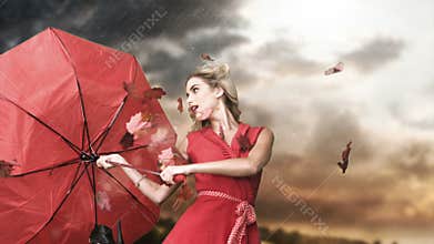 Glamour woman holding a broken umbrella in cinemagraph