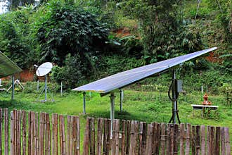 Renewable solar energy and telecommunications in a village of East Asia, in jungle